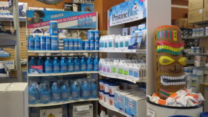 pool supplies chemicals on a shelf and a tiki float