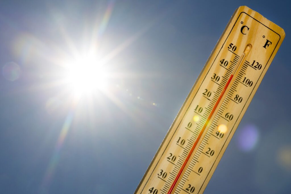 How to Keep Your Hot Tub from Overheating in the Texas Heat 5 A basic thermometer reading above 100 degrees Fahrenheit is pictured in front of a bright sun.
