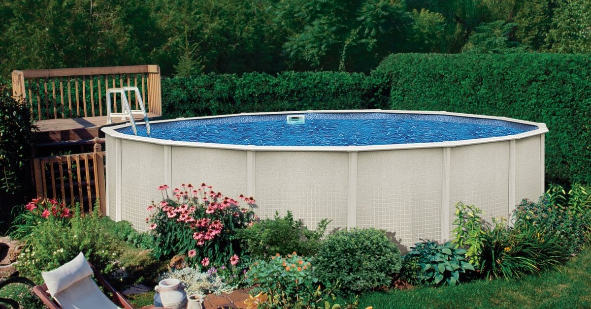 This is an above-ground pool in a backyard setting surrounded by landscaping and a small deck